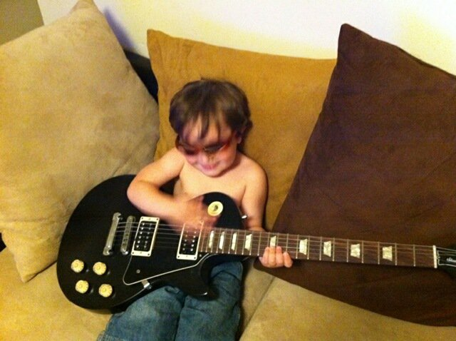 Little Kyser with his first guitar